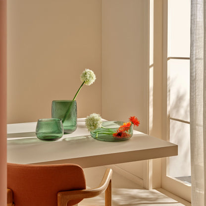 A collection of NUDE Glass Opti crystal vases in tall, medium, and centerpiece sizes