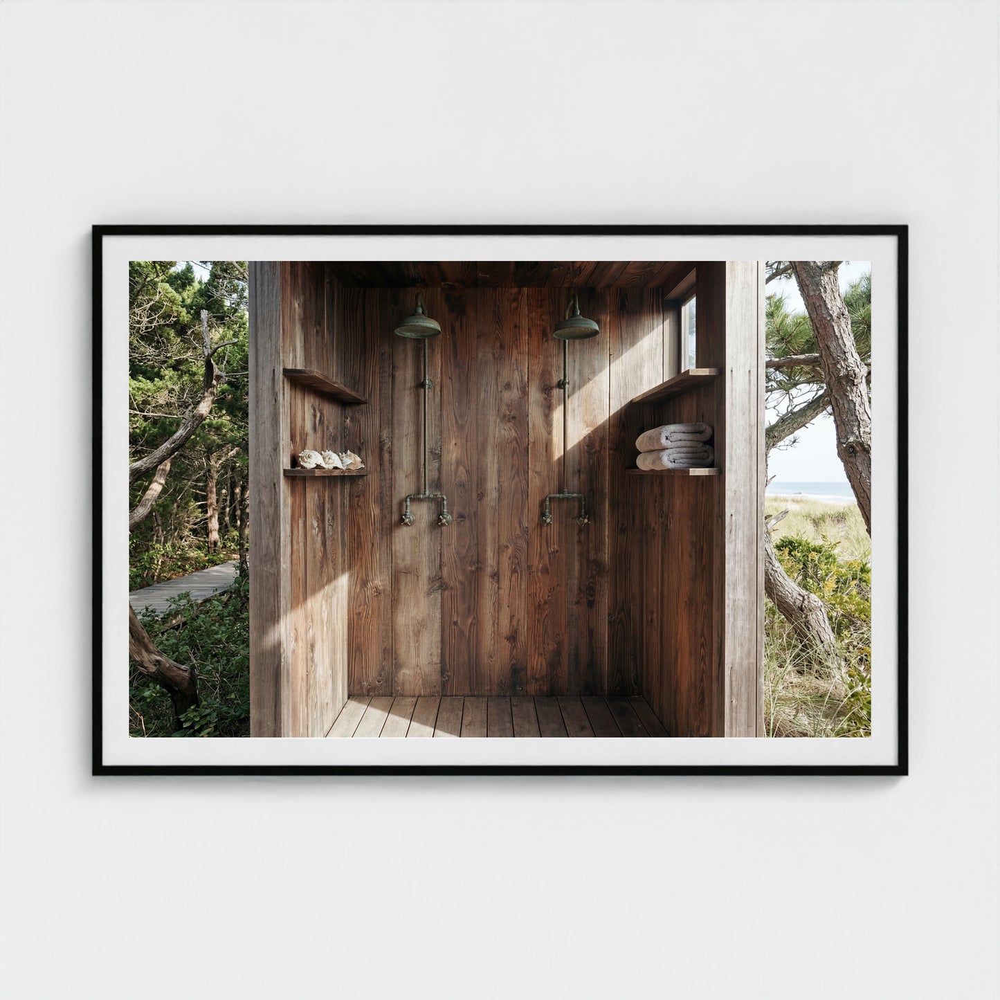 Grand scale 60x40 Pines Outdoor Shower art print in a black wood landscape frame over a minimalist sofa.