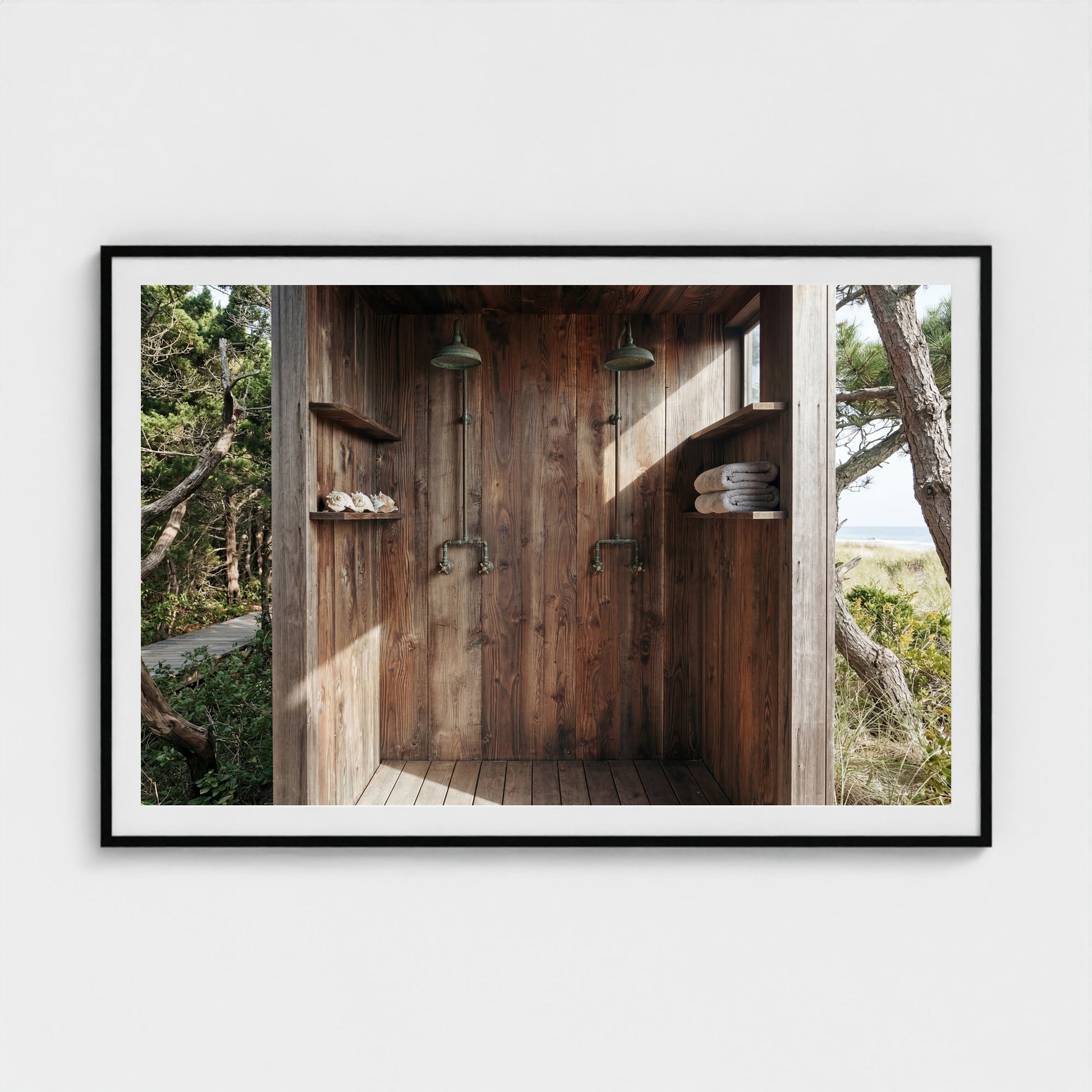 Grand scale 60x40 Pines Outdoor Shower art print in a black wood landscape frame over a minimalist sofa.