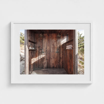 Pines Outdoor Shower print in 24x18 white frame styled on interior wall
