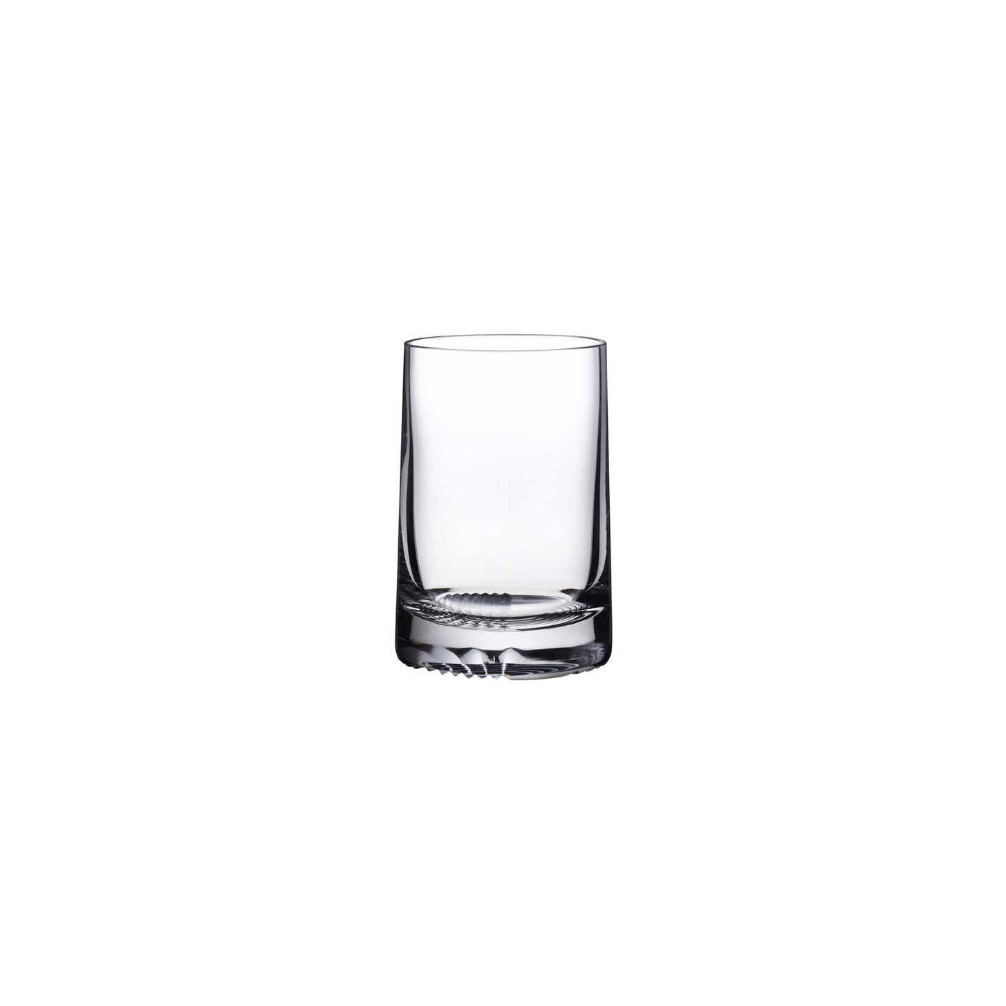 Side profile of a premium crystal whiskey glass showing its elegant tapered shape and heavy patterned bottom.