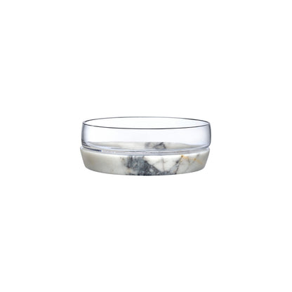 Clear crystal serving bowl separated from its sculptural white marble cooling base