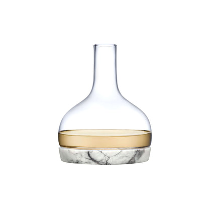 Minimalist crystal carafe with a white marble base on a clean white background.