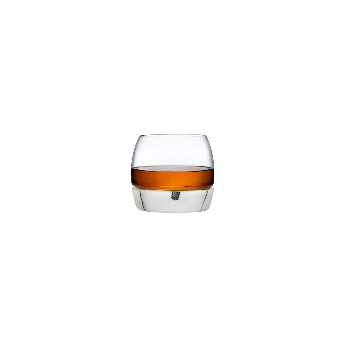 Modern crystal whiskey tumbler resting on a solid white marble cooling base.