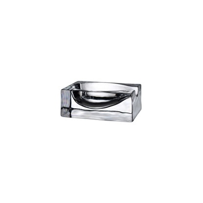 Minimalist clear crystalline glass spoon rest by NUDE Glass shown on a clean backdrop