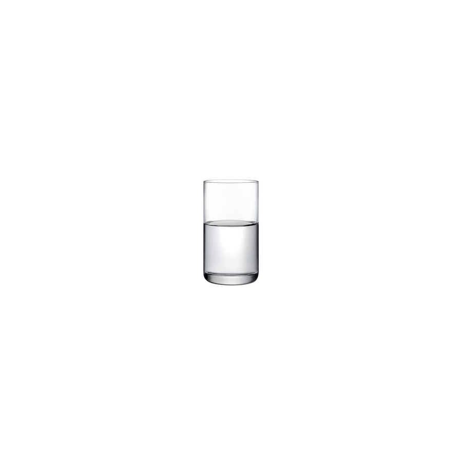 A minimalist NUDE Glass Finesse crystal shot glass showing its sleek profile and weighted base against a neutral background.