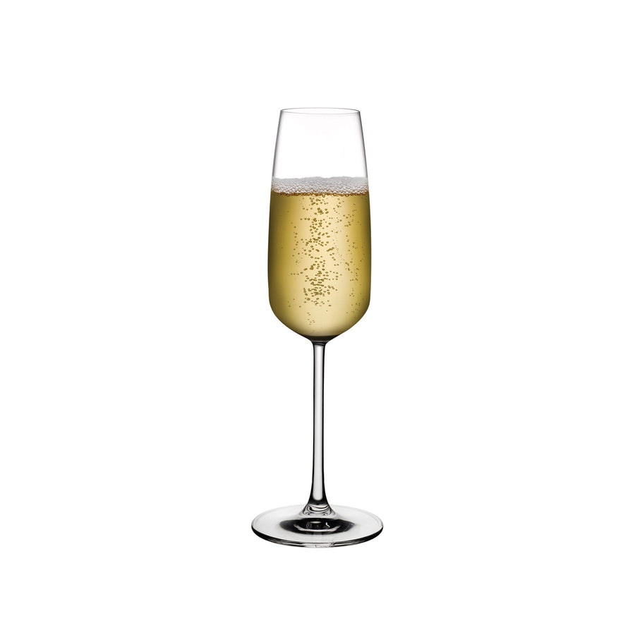 A single Mirage crystal champagne glass by NUDE Glass, displaying a minimalist design with a slender stem.
