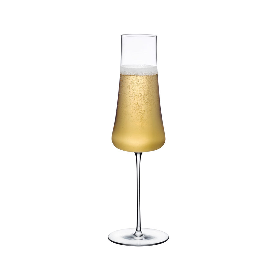 Elegant NUDE Stem Zero Volcano crystal champagne glass against a neutral background.
