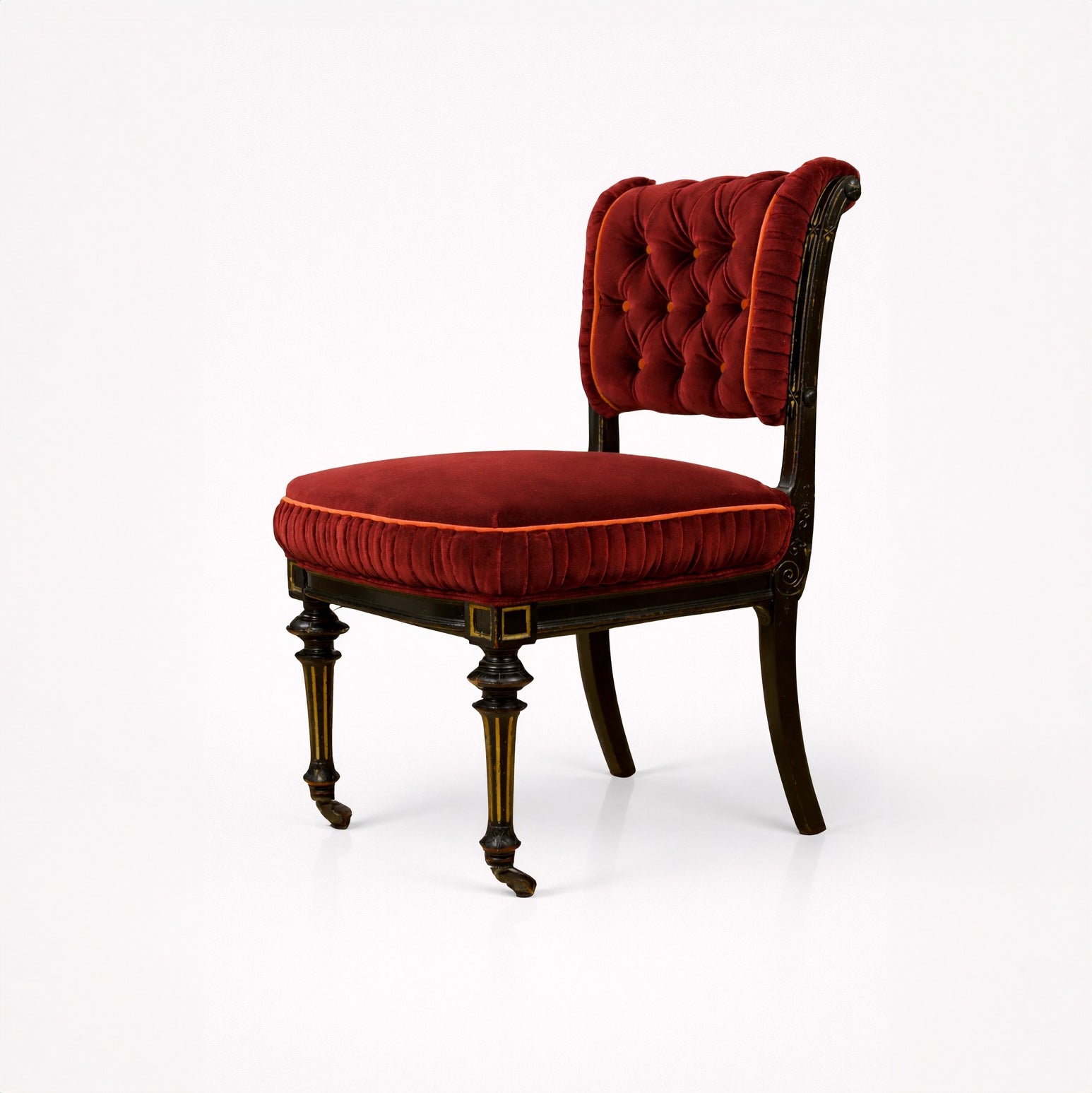 Red velvet chair with wooden legs on a white background