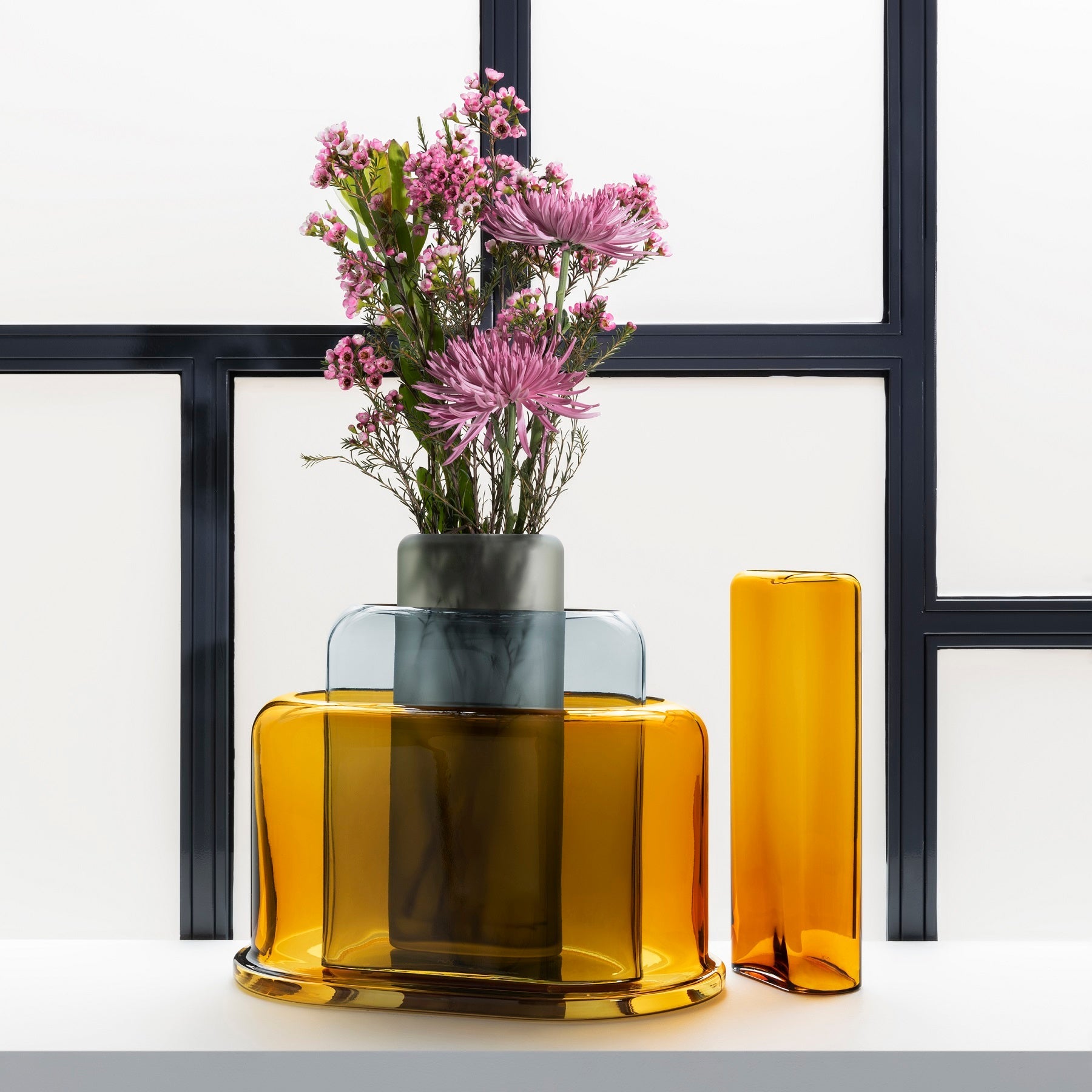 Modernist interior vignette styling featuring the minimalist Layers glass vase on a sleek surface.