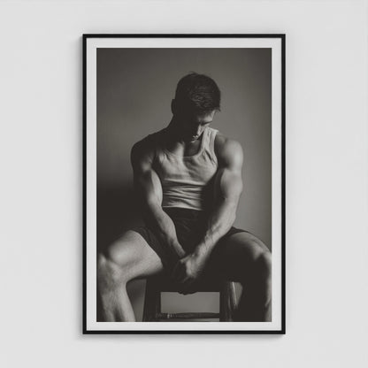 Contemplative male portrait study in denim, presented in a large forty by sixty black box frame.