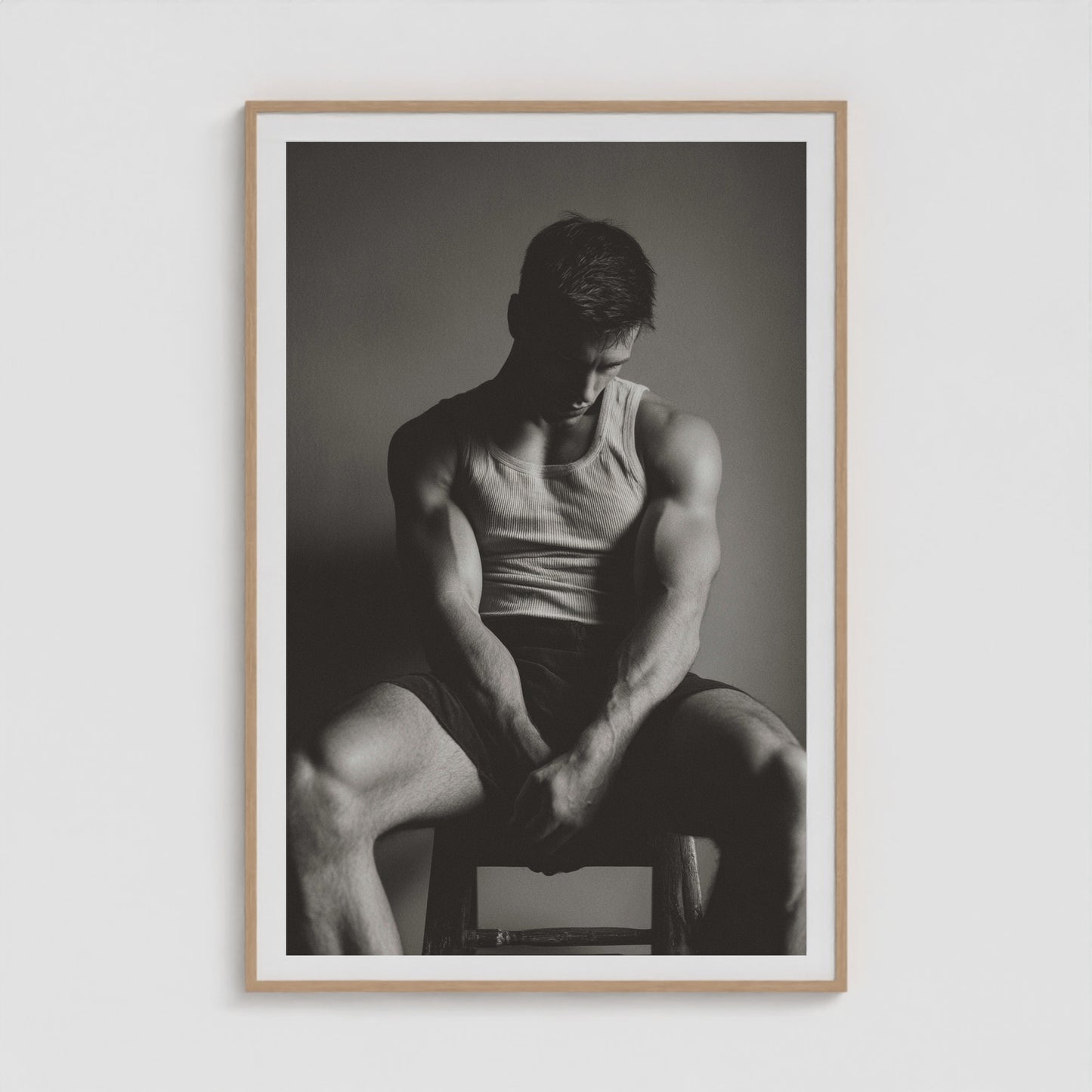 Sunlit denim male portrait study, shown in a large forty by sixty natural wood box frame.