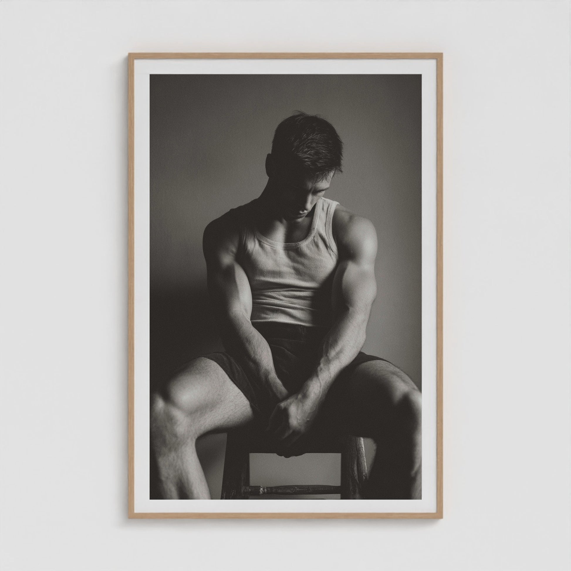 Atmospheric sunlit male portrait print in a forty by sixty natural wood gallery frame.