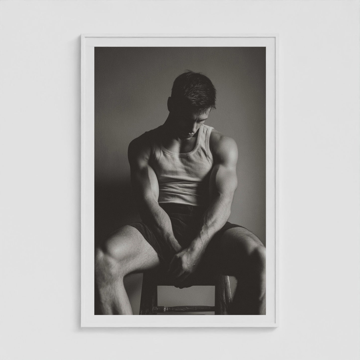 Atmospheric sunlit male portrait print in a forty by sixty white gallery frame.