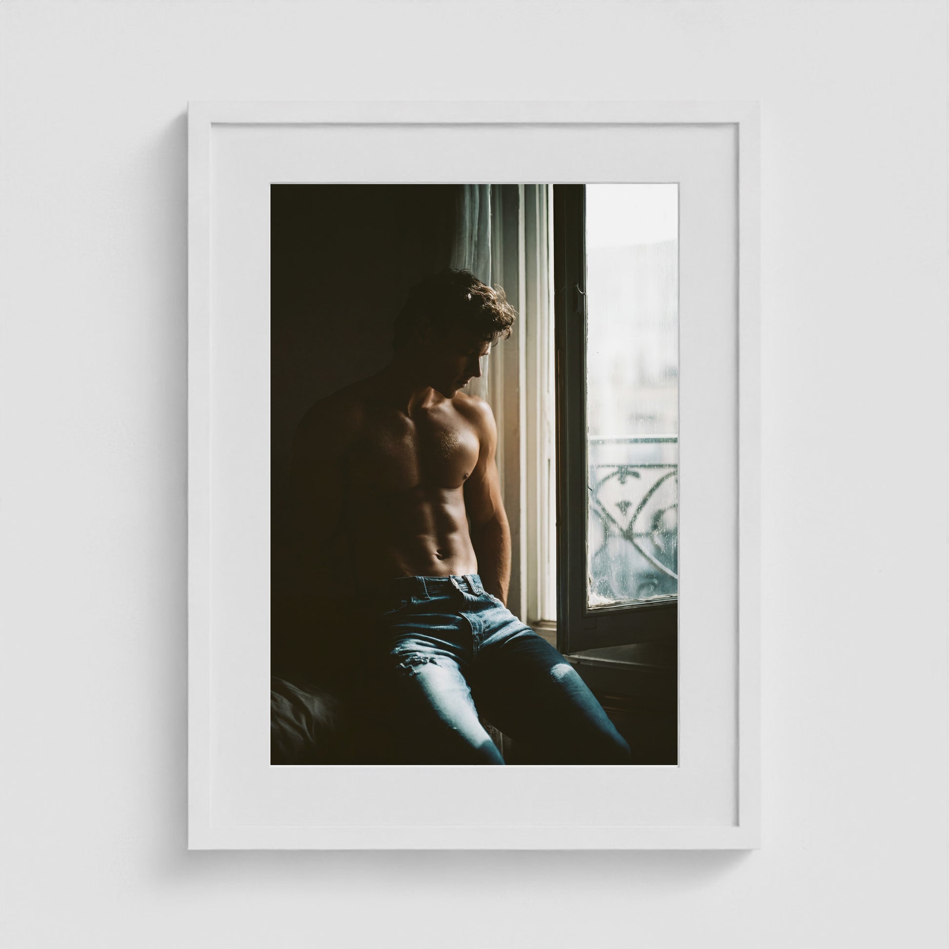 Contemplative window portrait art print in an 18x24 white box frame.