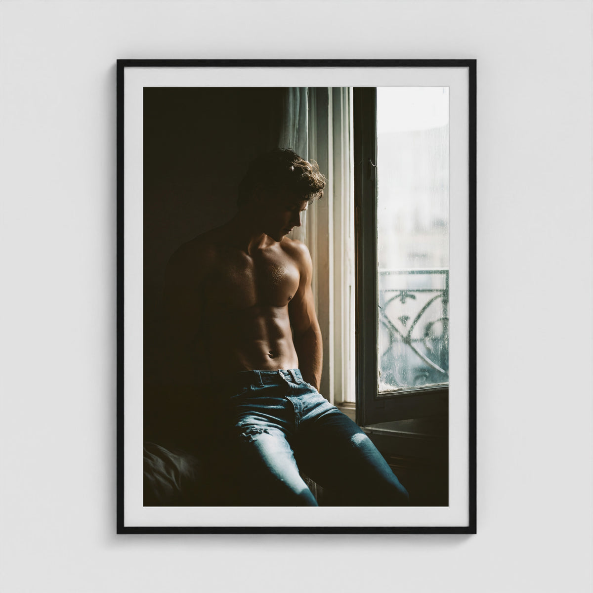 Contemplative window portrait art print in a 36x48 black box frame.