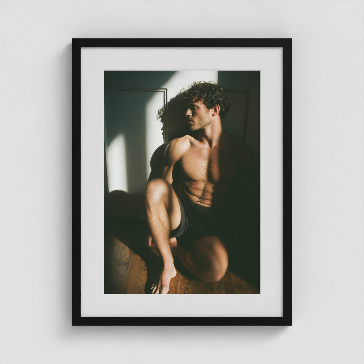 Minimalist male form art print framed in an 18x24 black portrait box frame.