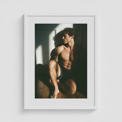 Minimalist male form art print framed in an 18x24 white portrait box frame.