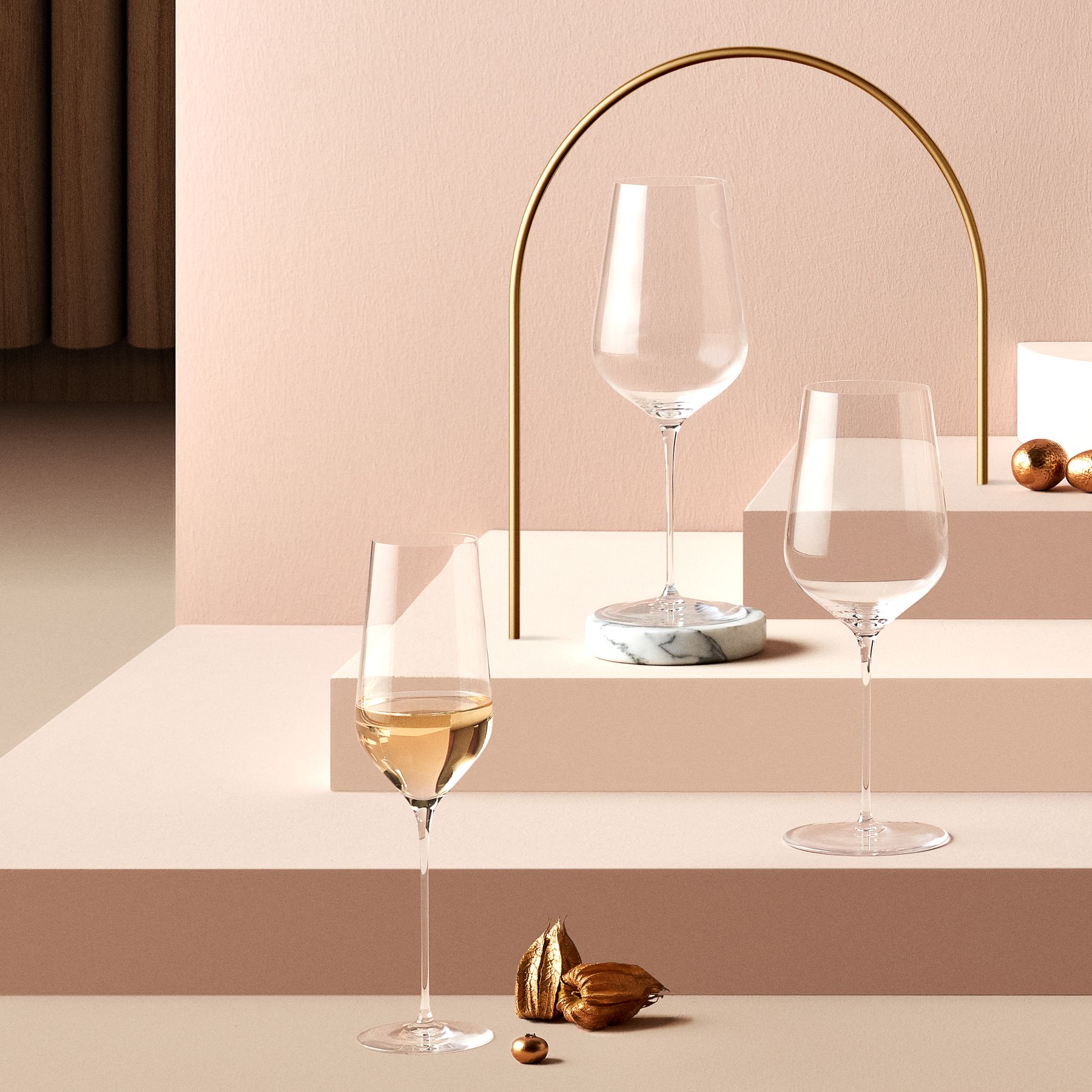 The Stem Zero Trio glassware collection arrayed on a modern dining table setting.
