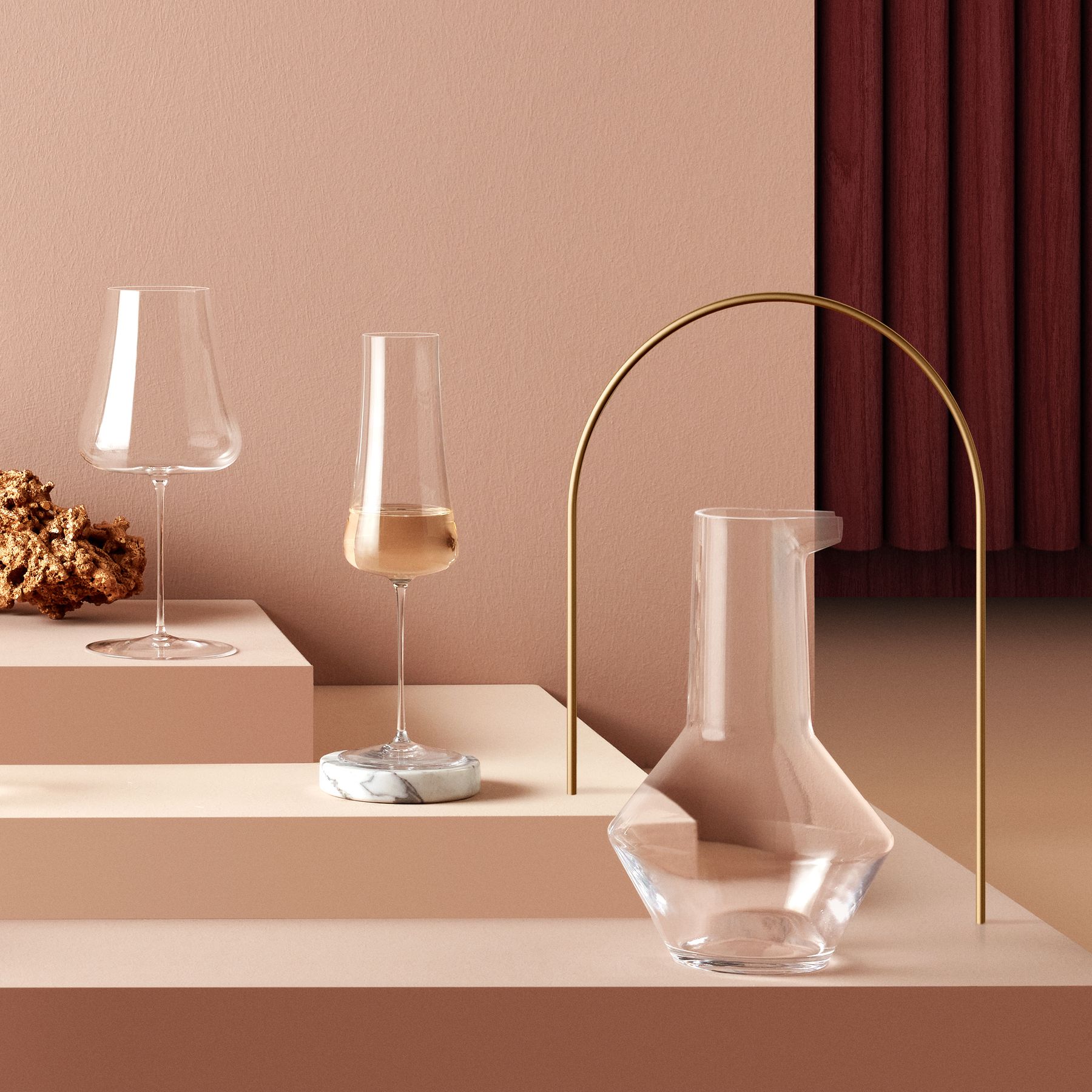 A beautiful arrangement of NUDE Glass Stem Zero Volcano wine glasses and a modern glass carafe.