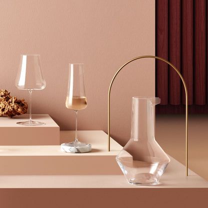 Elegant collection of contemporary wine and champagne stemware on a dining table.