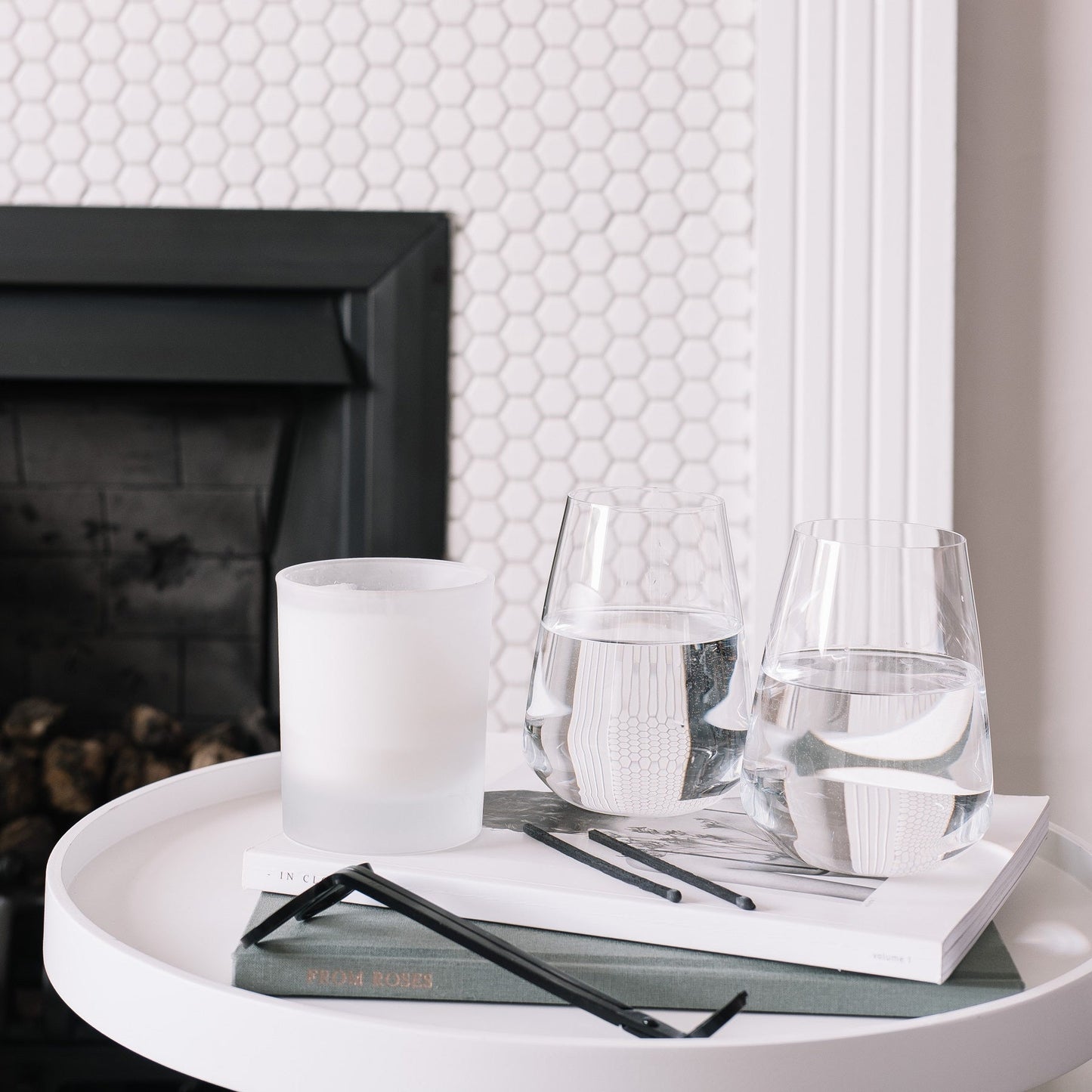 Detailed close-up of a Stem Zero crystal water glass filled with sparkling water and a lemon slice.