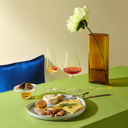 Curated dining table setting featuring premium wine glassware and the tall Layers vase.