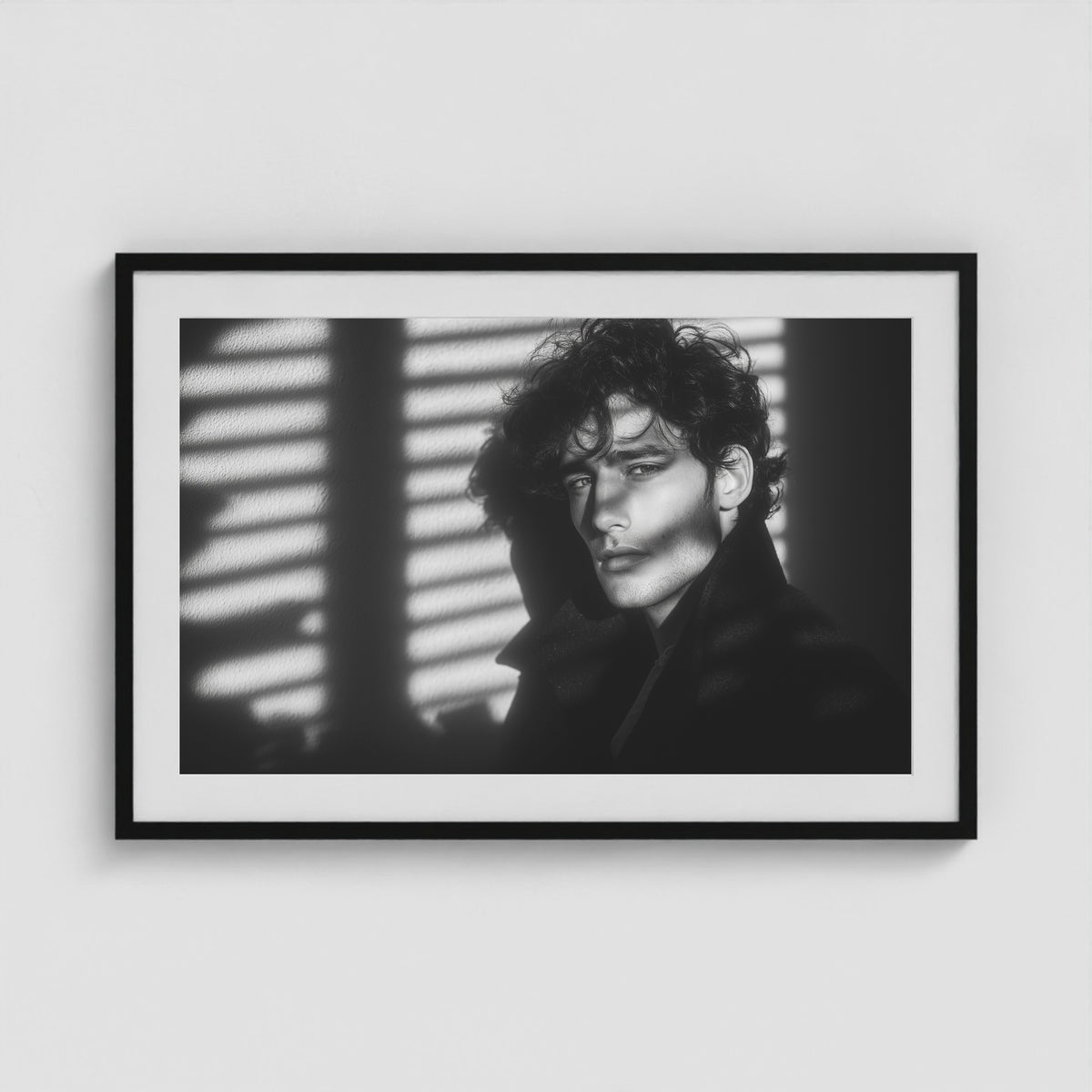 Framed black-and-white male portrait art print in a 36x24 black landscape-oriented box frame.