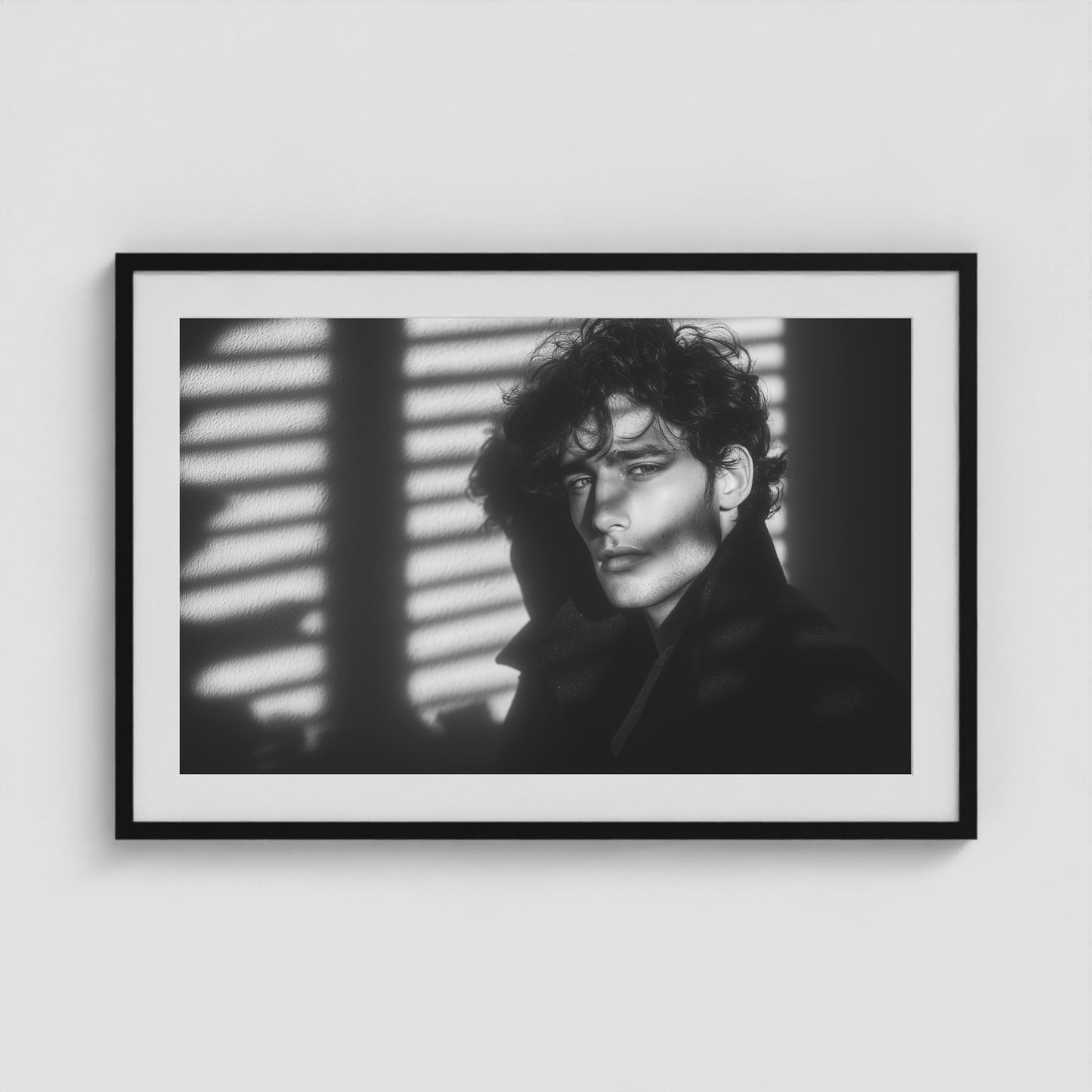 Introspective male portrait fine art print in a 36x24 black box frame, hanging in a modern interior.