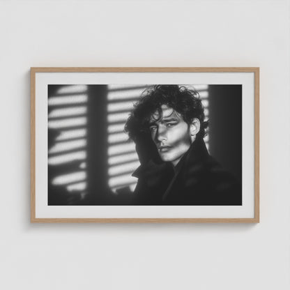 Framed black-and-white male portrait art print in a 36x24 natural wood landscape box frame.