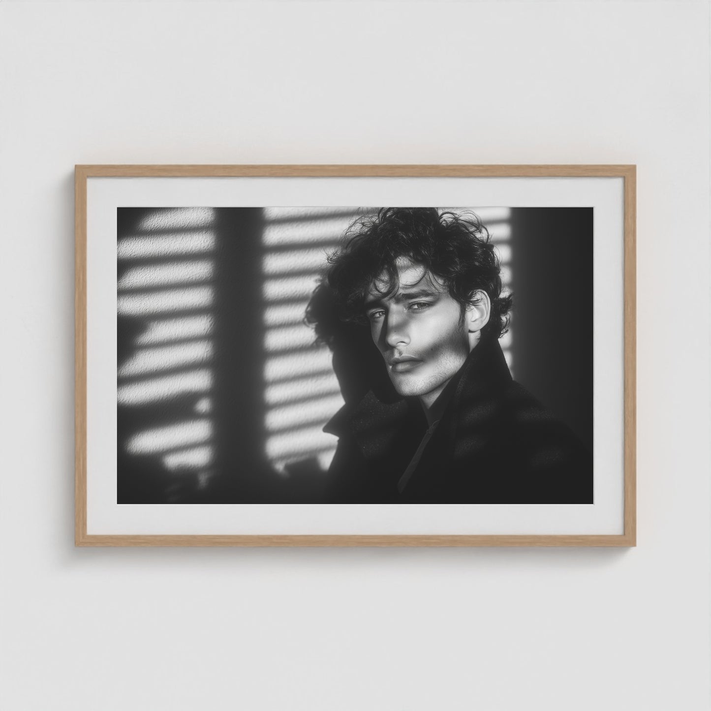 Introspective male portrait fine art print in a 36x24 natural oak wood box frame on a gallery wall.