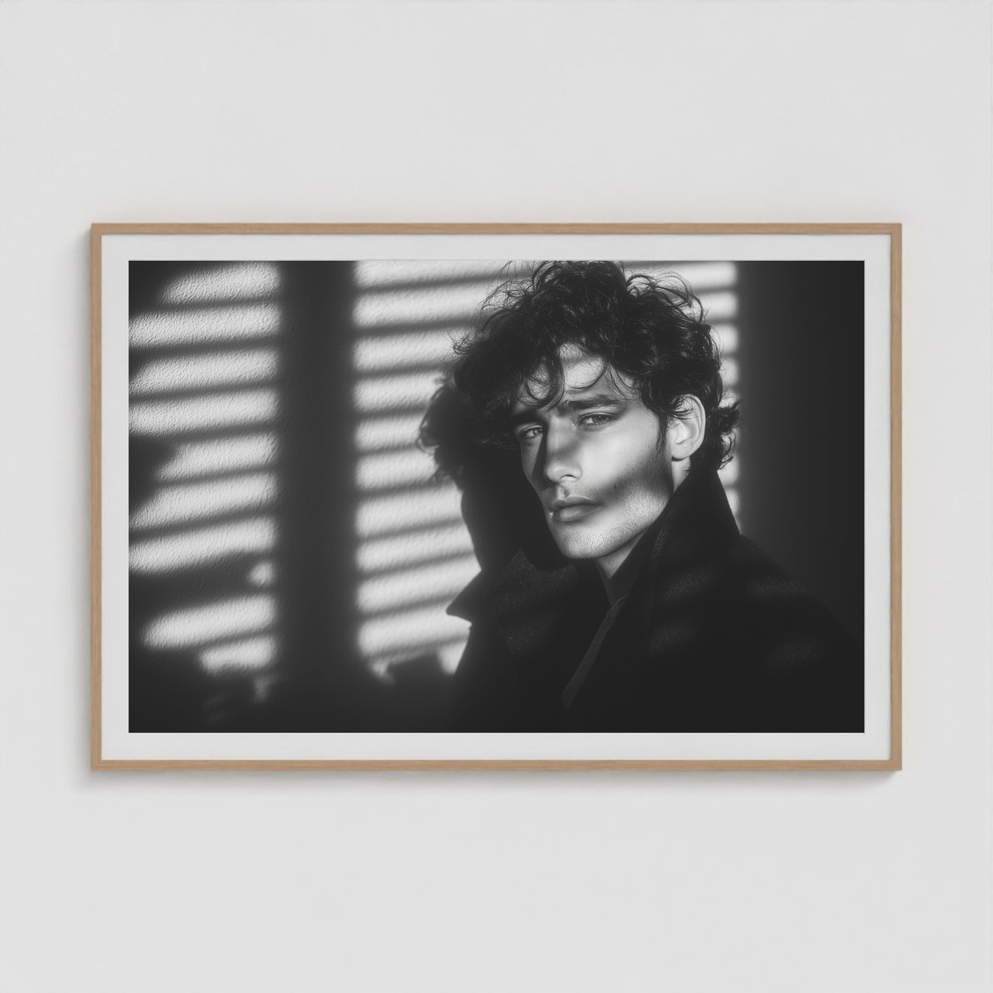 Large 60x40 black-and-white portrait print in a natural wood frame, showcased in a minimalist living room.