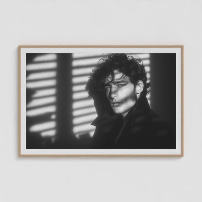Large 60x40 black-and-white portrait print in a natural wood frame, showcased in a minimalist living room.