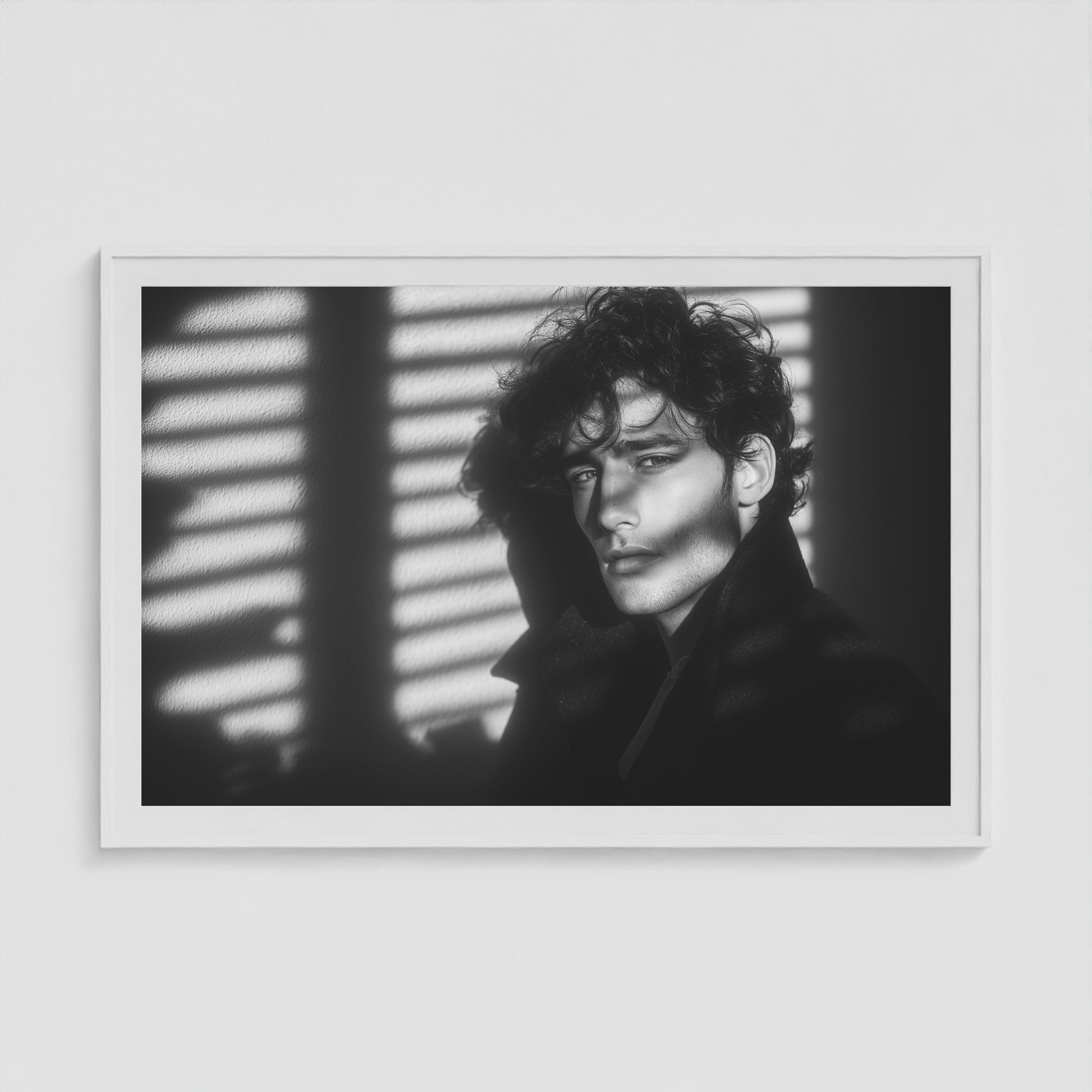 Framed black-and-white male portrait art print in a large 60x40 white landscape box frame.