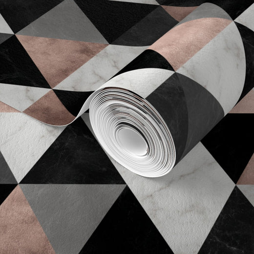 Close-up of the geometric pink, grey, and black marble mosaic pattern on matte traditional non-pasted wallpaper.