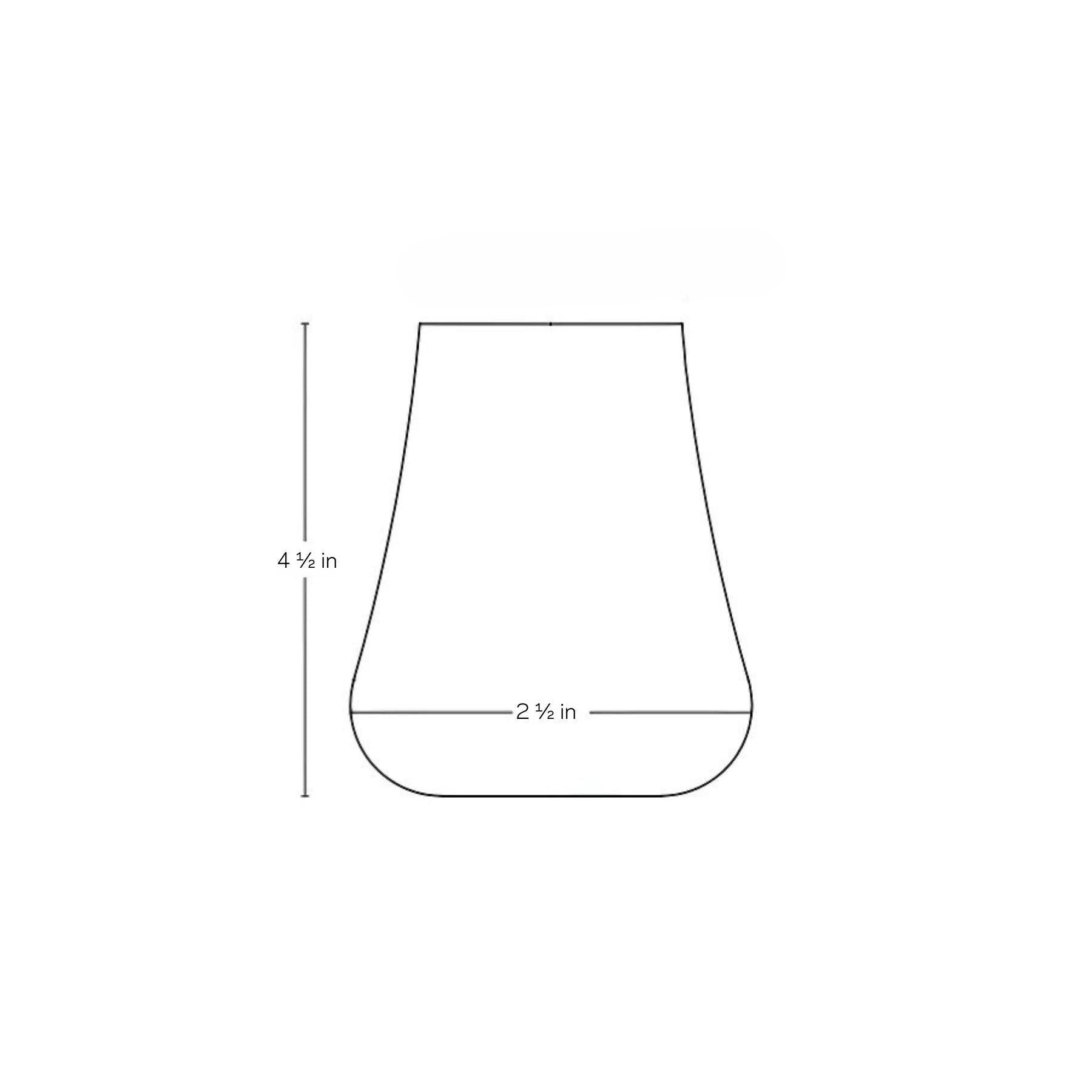 NUDE Glass Stem Zero Volcano glass alongside complementary modern dinnerware.