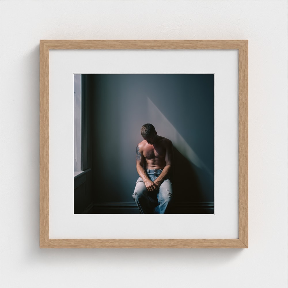 Contemplative Male Portrait Art Print in a 16x16 natural oak square frame
