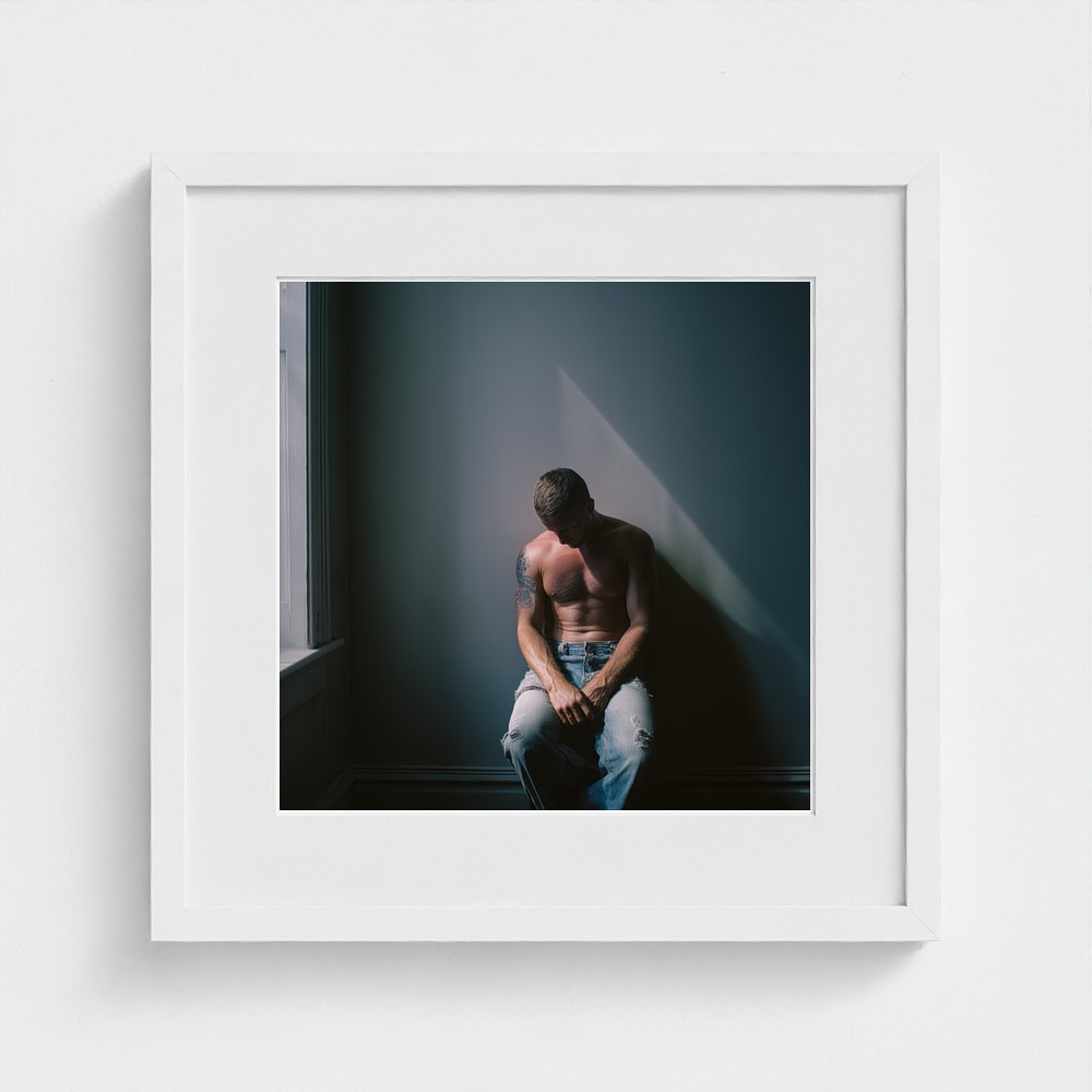 Contemplative Male Portrait Art Print in a 16x16 white square frame