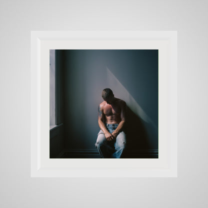 Front view of Contemplative Male Portrait Art Print in a 20x20 deep white square spacer frame