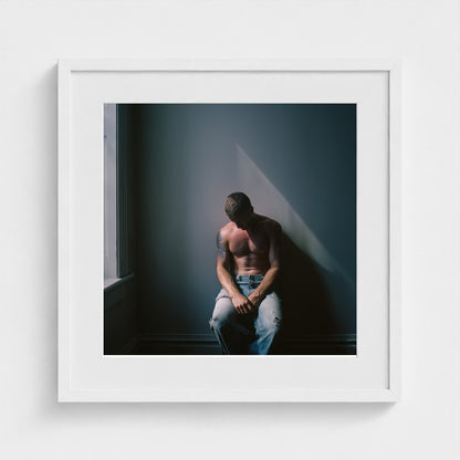 Contemplative Male Portrait Art Print in a 20x20 white square frame