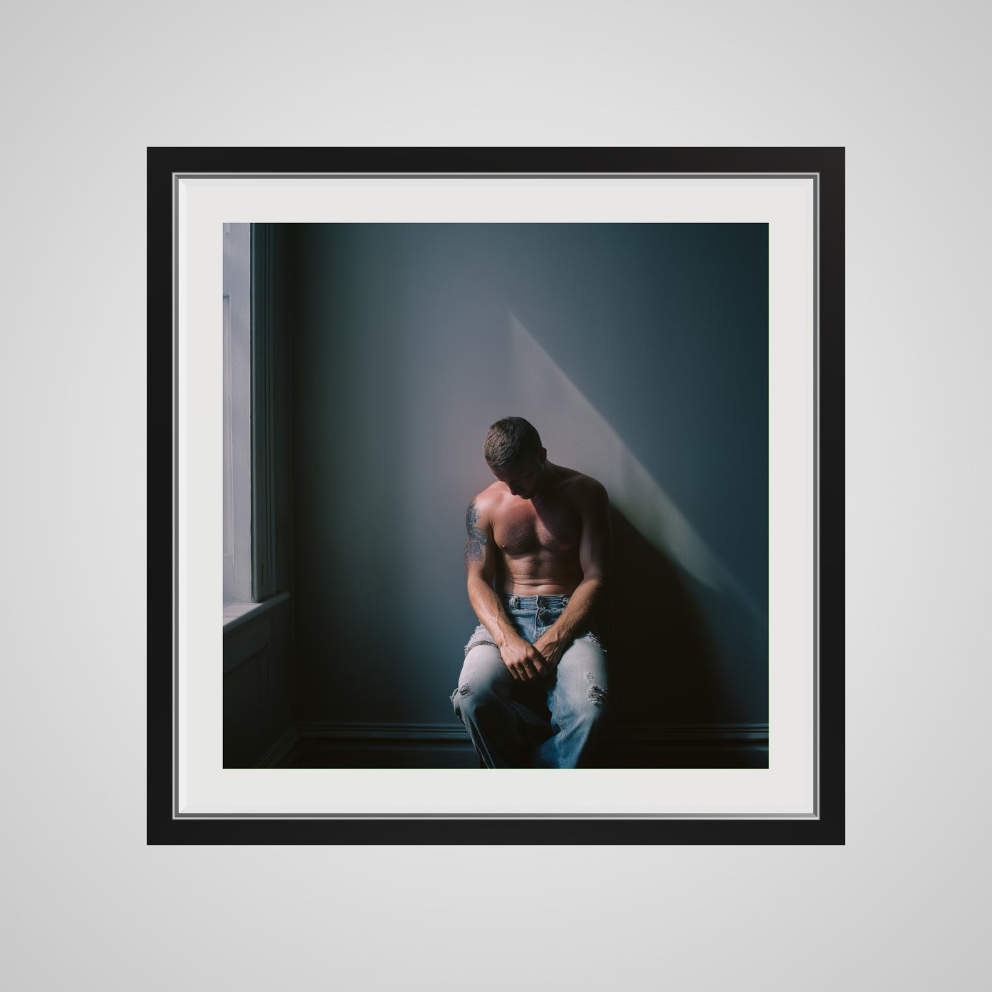 Front view of Contemplative Male Portrait Art Print in a 24x24 deep black square spacer frame
