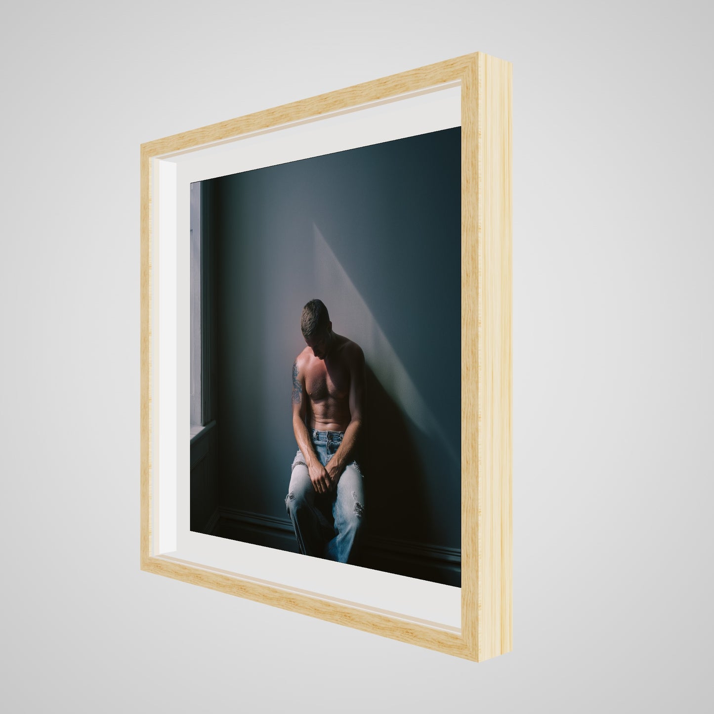 Angled view of Contemplative Male Portrait Art Print in a 24x24 deep natural square spacer frame