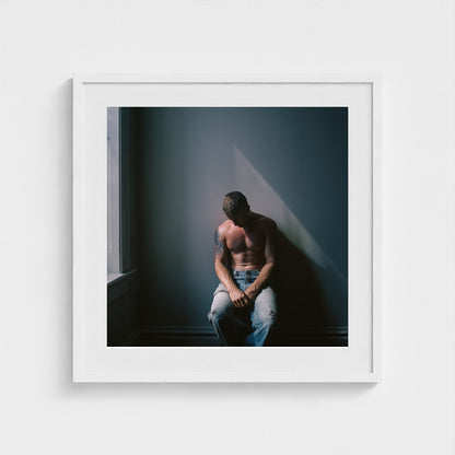 Contemplative Male Portrait Art Print in a 24x24 white square frame