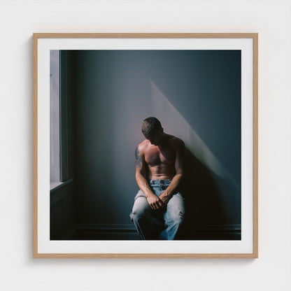 Contemplative Male Portrait Art Print in a 36x36 natural wood square frame