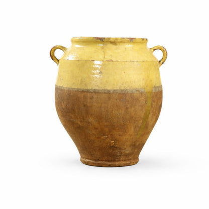 Ceramic vase with a yellow top and brown bottom on a white background