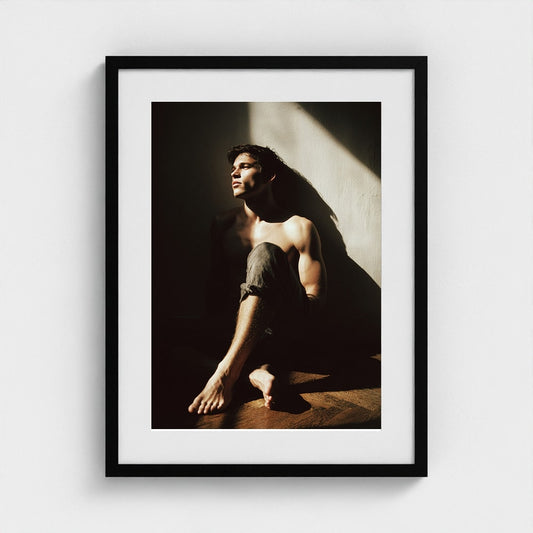 Contemplative Male Portrait in Sunlit Denim Study