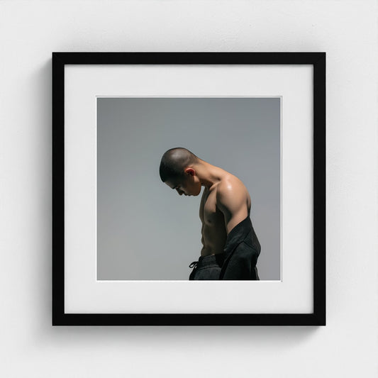 Contemplative Male Torso Portrait in Soft Gray Tones