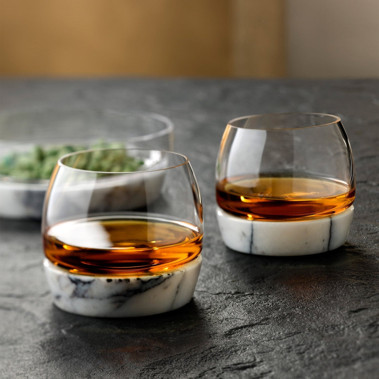 Set of crystal glasses and decanter from the Chill collection on a table.