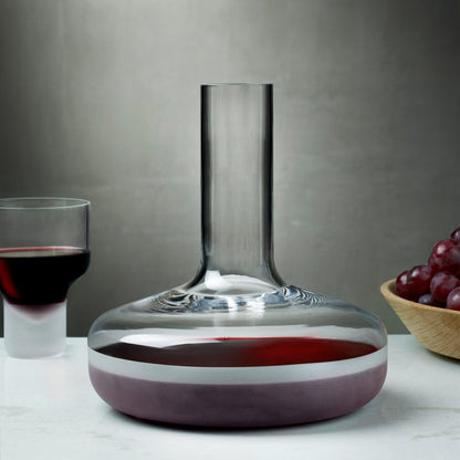 The modern Contour crystal wine carafe styled in an elegant, contemporary dining table setting.