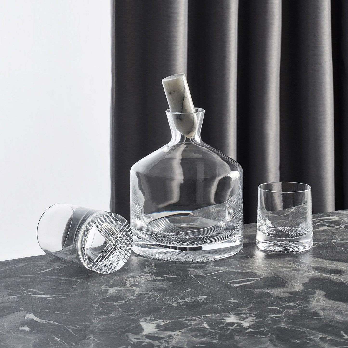 Curated lifestyle setting with the NUDE Glass Alba decanter, tumblers, and elegant bar accessories